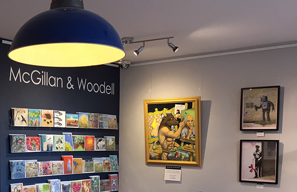 "A Minor Tour Of The Labyrinth" next to Banksy prints at the McGillan And Woodell Gallery